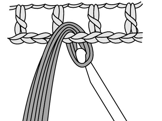 Draw the loop through the stitch that you’re attaching the fringe to.